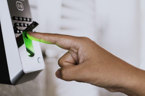 Scanning finger on a coronavirus contaminated fingerprint access control Scanning finger on a coronavirus contaminated fingerprint access control
